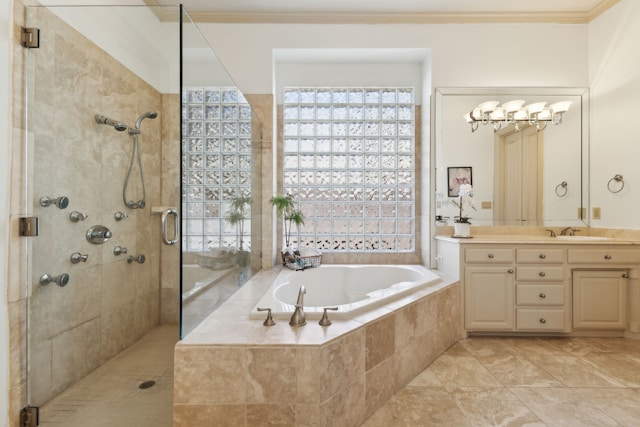 full bathroom with vanity, tiled shower, ornamental molding, a garden tub, and a notable chandelier