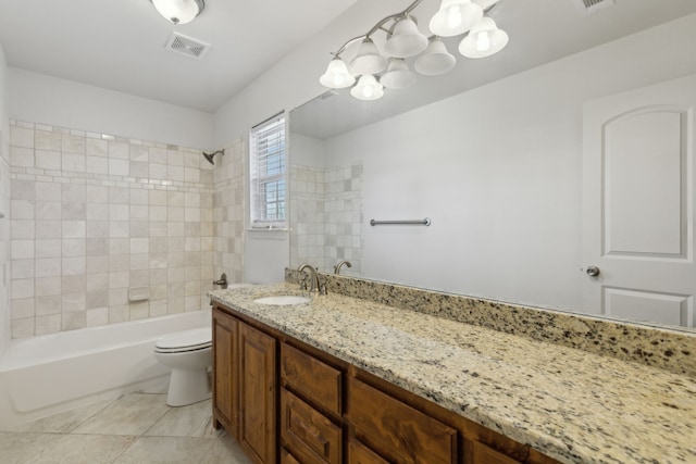 bathroom featuring visible vents, toilet, shower / bath combination, and vanity