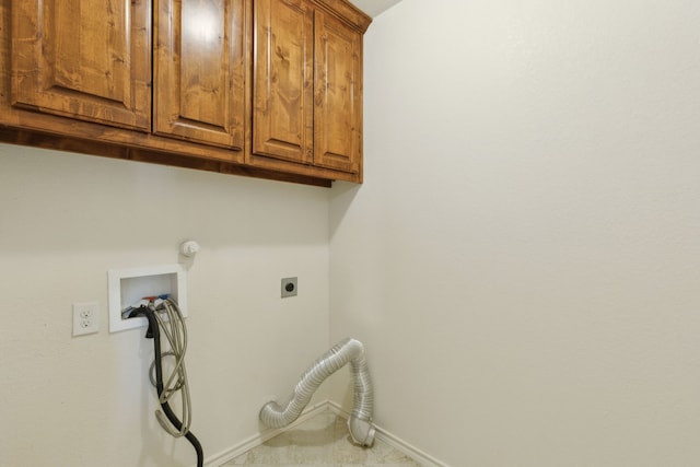 washroom with hookup for a washing machine, baseboards, gas dryer hookup, cabinet space, and electric dryer hookup