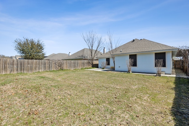 view of yard featuring a patio and a fenced backyard