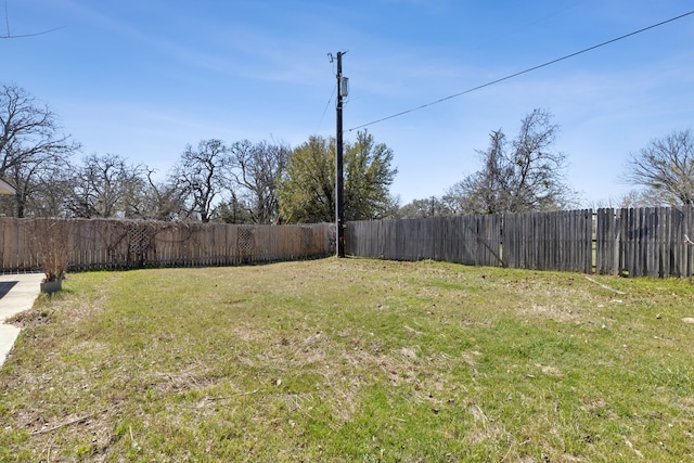 view of yard with a fenced backyard