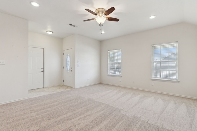 unfurnished room featuring baseboards, visible vents, recessed lighting, ceiling fan, and light colored carpet