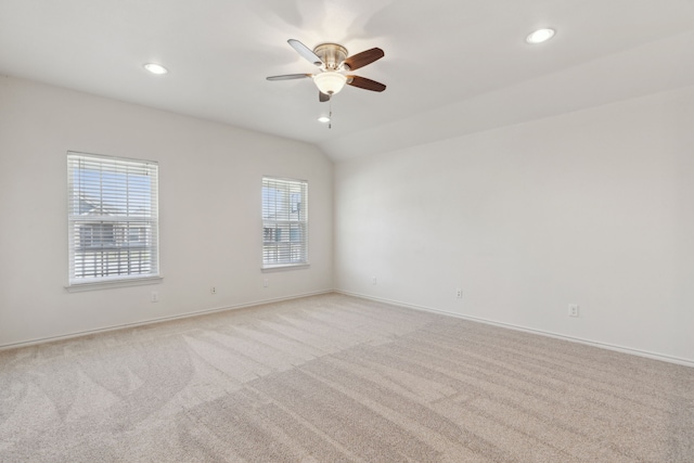 unfurnished room featuring recessed lighting, light carpet, lofted ceiling, and ceiling fan