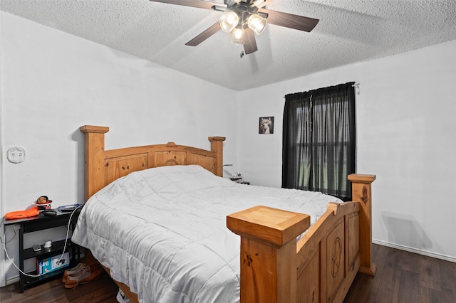 bedroom with dark wood finished floors, a textured ceiling, and ceiling fan