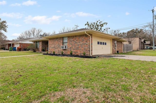 view of front of property with a front lawn, fence, concrete driveway, a garage, and brick siding