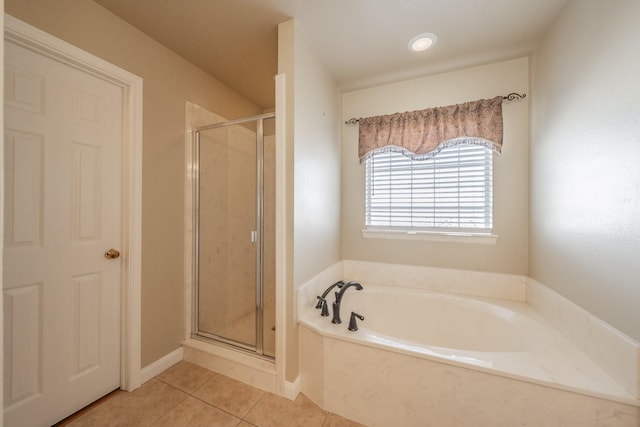 full bath with a garden tub, a stall shower, and tile patterned flooring