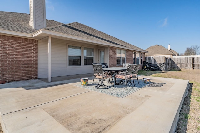 view of patio / terrace featuring fence