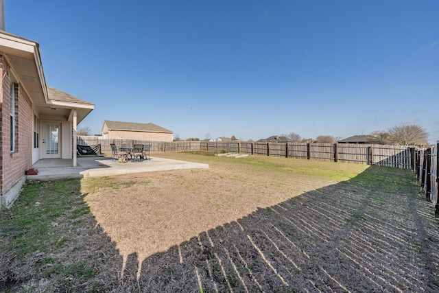 view of yard with a patio and a fenced backyard