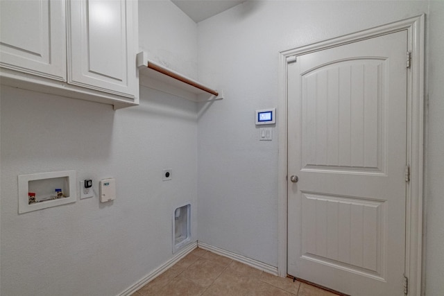 laundry area featuring hookup for a gas dryer, cabinet space, light tile patterned flooring, hookup for an electric dryer, and hookup for a washing machine