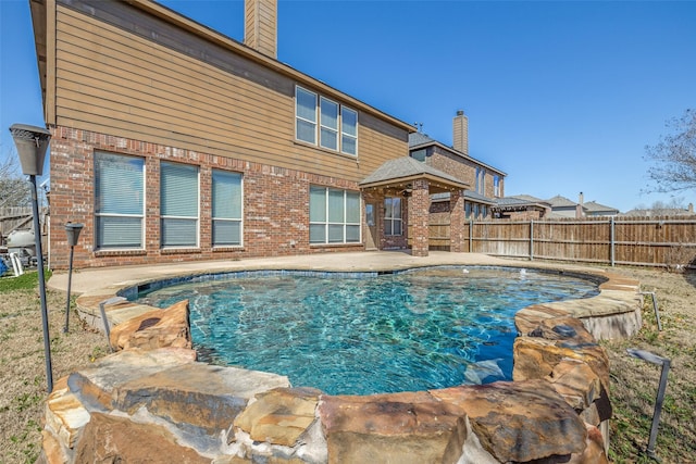 view of pool with a fenced in pool, a patio, and a fenced backyard