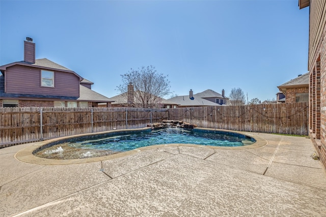 view of swimming pool featuring a fenced backyard, a fenced in pool, and a patio