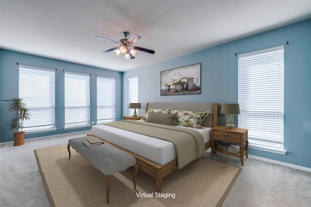 bedroom with a ceiling fan, carpet, and baseboards