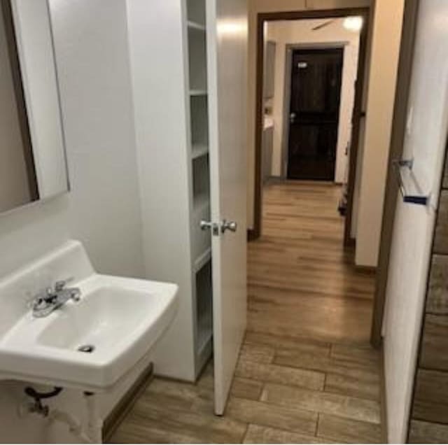 bathroom featuring a sink and wood finished floors