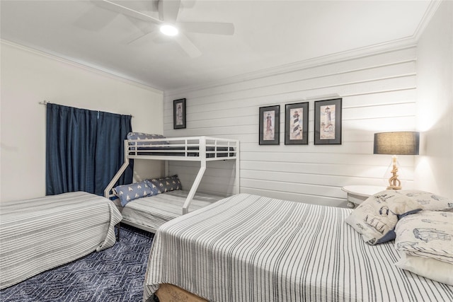 bedroom featuring a ceiling fan and ornamental molding