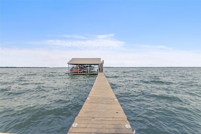 dock area with a water view