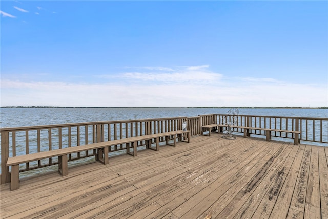 dock area with a deck with water view