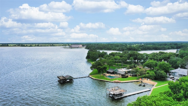 birds eye view of property with a water view