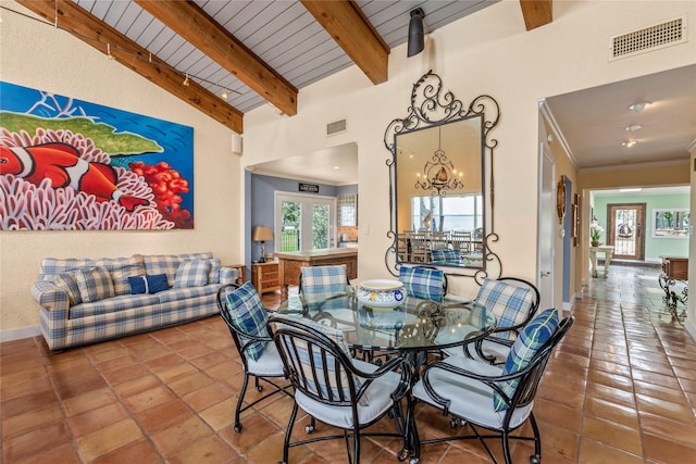 dining room featuring a notable chandelier, visible vents, wooden ceiling, and baseboards