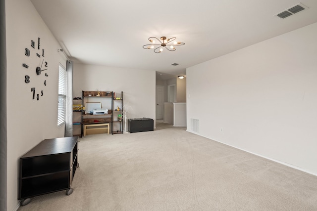 living room featuring a notable chandelier, carpet flooring, and visible vents