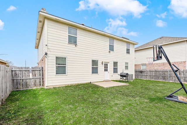 rear view of property with a patio, a lawn, and a fenced backyard