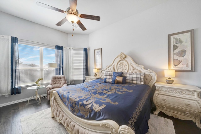 bedroom featuring baseboards, a ceiling fan, and wood finished floors