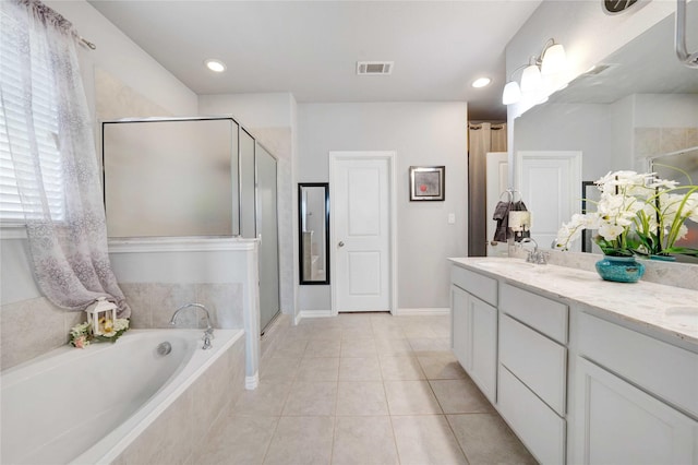 132 Mossy Oak Trl, Fort Worth, TX 76131 - full bathroom featuring a stall shower, a bath, double vanity, tile patterned flooring, and baseboards