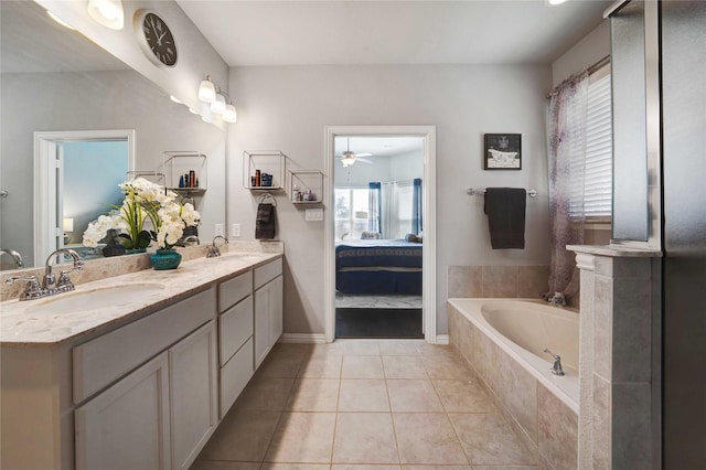 full bath featuring tile patterned flooring, ensuite bathroom, a garden tub, and a sink