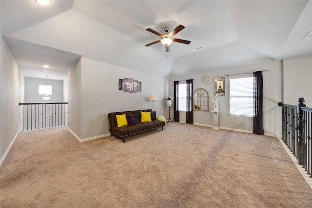 sitting room with visible vents, baseboards, carpet, lofted ceiling, and a ceiling fan