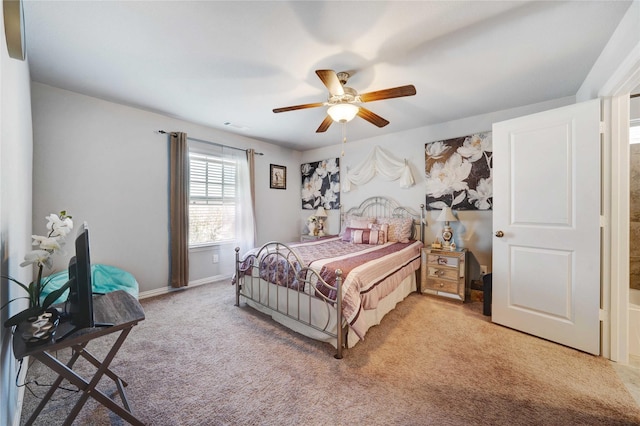 bedroom featuring baseboards, light colored carpet, and a ceiling fan