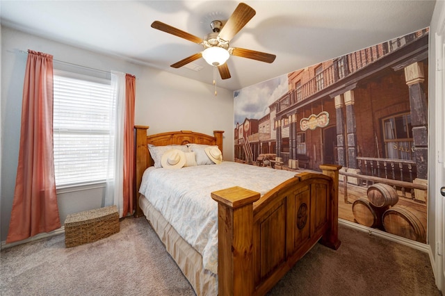 bedroom with ceiling fan and carpet floors