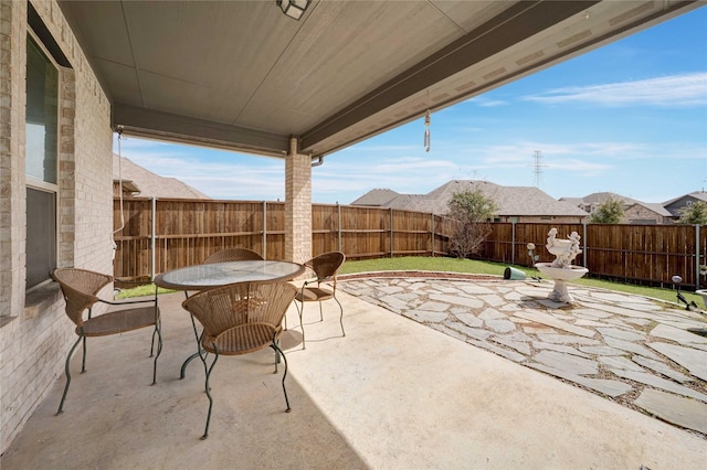 view of patio / terrace featuring outdoor dining area and a fenced backyard