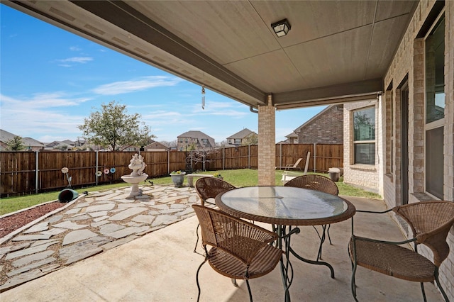 view of patio / terrace with outdoor dining space and a fenced backyard