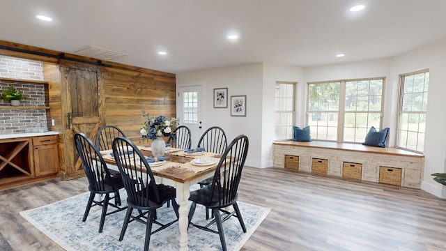 dining space with visible vents, recessed lighting, light wood-type flooring, and baseboards