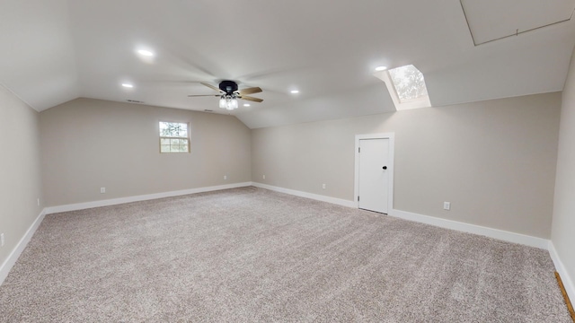 bonus room featuring baseboards, light colored carpet, a ceiling fan, and vaulted ceiling