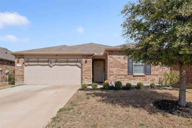 view of front of house with brick siding, concrete driveway, and an attached garage