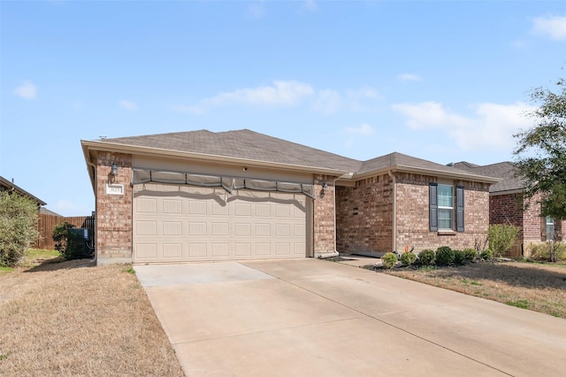 ranch-style home with an attached garage, fence, brick siding, and driveway