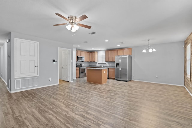 kitchen with visible vents, appliances with stainless steel finishes, and open floor plan