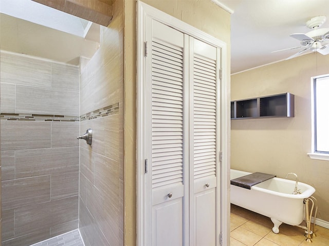 full bath featuring tiled shower, a soaking tub, ceiling fan, tile patterned flooring, and a closet