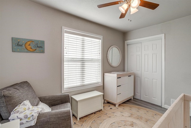 interior space with ceiling fan, a closet, and light wood-type flooring