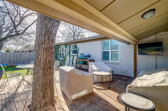 wooden deck with grilling area and fence