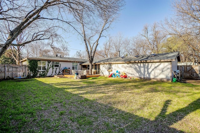 view of yard featuring a fenced backyard and a wooden deck