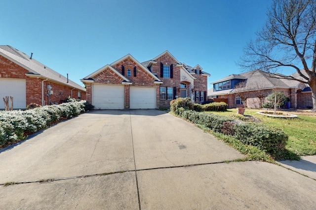 traditional-style house with a garage, brick siding, and driveway