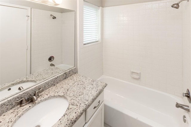 bathroom with vanity and shower / bathing tub combination