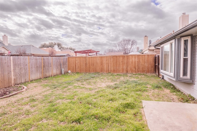 view of yard with a fenced backyard