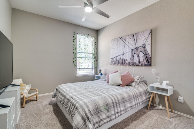 bedroom featuring carpet flooring, a ceiling fan, and baseboards