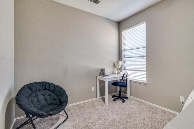 office space with visible vents, baseboards, and carpet floors