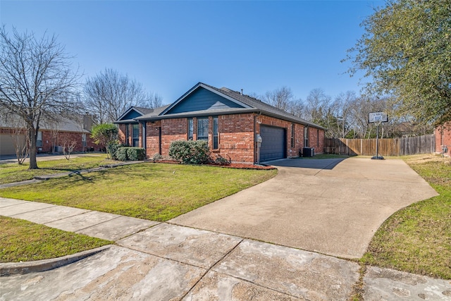 view of front facade with a front yard, fence, an attached garage, concrete driveway, and brick siding