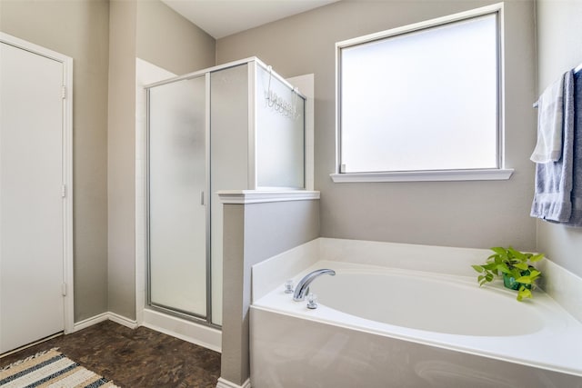 bathroom with a garden tub and a shower stall