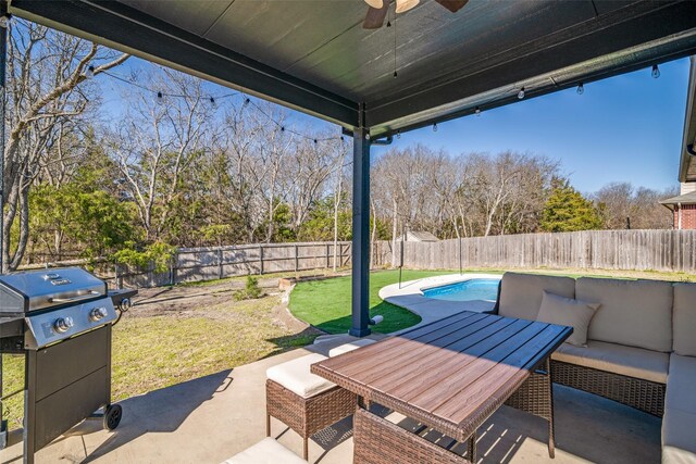 view of patio / terrace featuring area for grilling, a ceiling fan, outdoor lounge area, and a fenced backyard