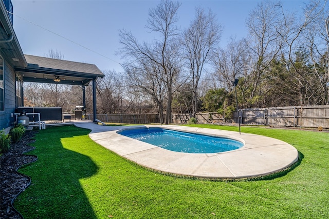 view of swimming pool featuring a lawn, a fenced backyard, a grill, a fenced in pool, and a patio area